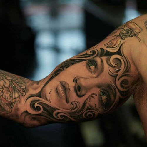 inner bicep bicep portrait tattoos