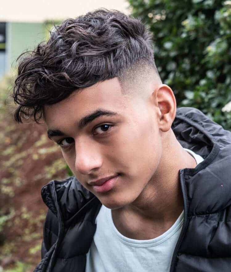 Mid Fade and Wavy Top Hairstyle For Guys 2022